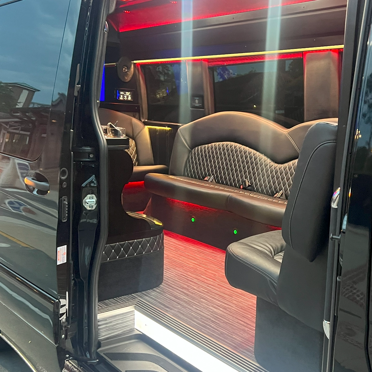 The clean and modern interior of a Sprinter limo for group travel to Port Canaveral.